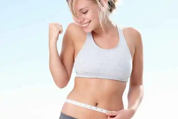 woman happy after fat reduction treatment Canary Wharf