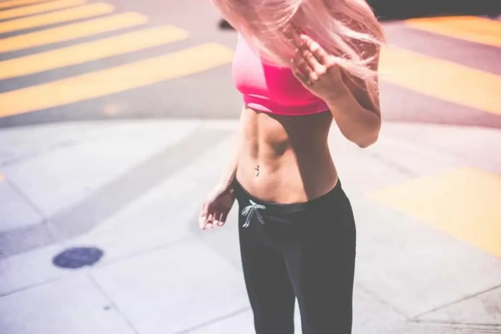 Woman with toned stomach after LA-EMS Body Sculpting Treatment Canary Wharf 